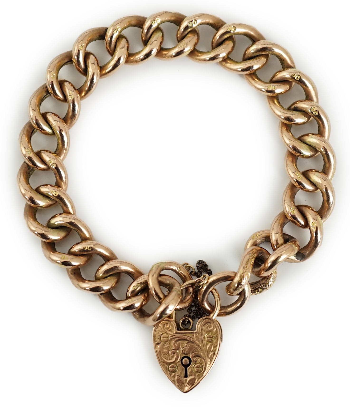 An Edwardian 9ct engraved curb link bracelet, with heart shape padlock clasp